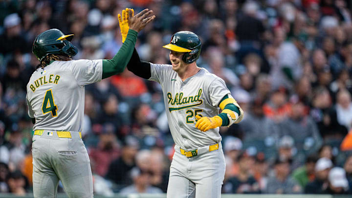 Jul 30, 2024; San Francisco, California, USA;  Oakland Athletics right fielder Lawrence Butler (4) congratulates Oakland Athletics designated hitter Brent Rooker (25) after hitting a two-run home run against the San Francisco Giants during the fifth inning at Oracle Park. Mandatory Credit: Neville E. Guard-Imagn Images