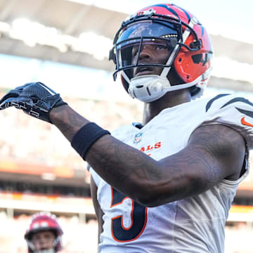 Cincinnati Bengals wide receiver Tee Higgins (5) runs through the end zone on a touchdown reception in the first quarter of the NFL Preseason Week 1 game between the Cincinnati Bengals and the Tampa Bay Buccaneers at Paycor Stadium in downtown Cincinnati on Saturday, Aug. 10, 2024.