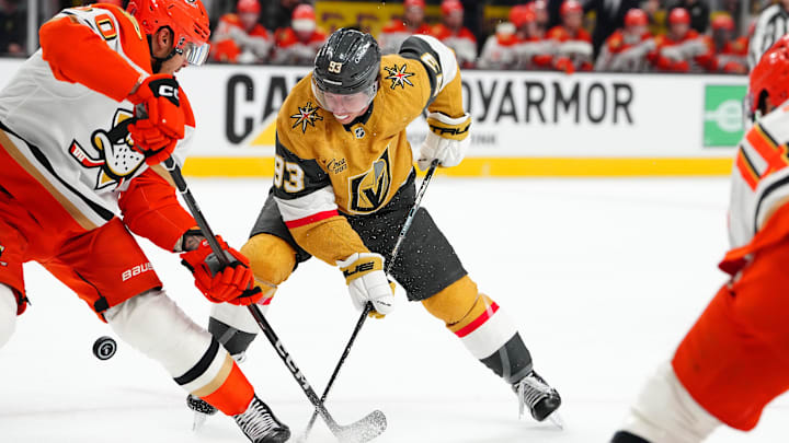 May 4, 2026; Las Vegas, Nevada, USA; Vegas Golden Knights right wing Mitch Marner (93) tips the puck away from Anaheim Ducks defenseman Tyson Hinds (60) during the first period of game one of the second round of the 2026 Stanley Cup Playoffs at T-Mobile Arena. Mandatory Credit: Stephen R. Sylvanie-Imagn Images