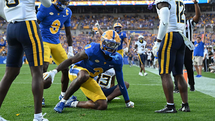 Pittsburgh Panthers wide receiver Daejon Reynolds (3) celebrates after a touchdown reception against West Virginia Mountaineers safety Anthony Wilson Jr. (12) in the fourth quarter at Acrisure Stadium.