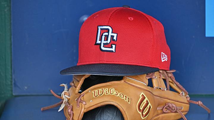 Aug 12, 2025; Kansas City, Missouri, USA;  A Washington Nationals hat and glove in the dugout before a game against the Kansas City Royals at Kauffman Stadium. Mandatory Credit: Peter Aiken-Imagn Images
