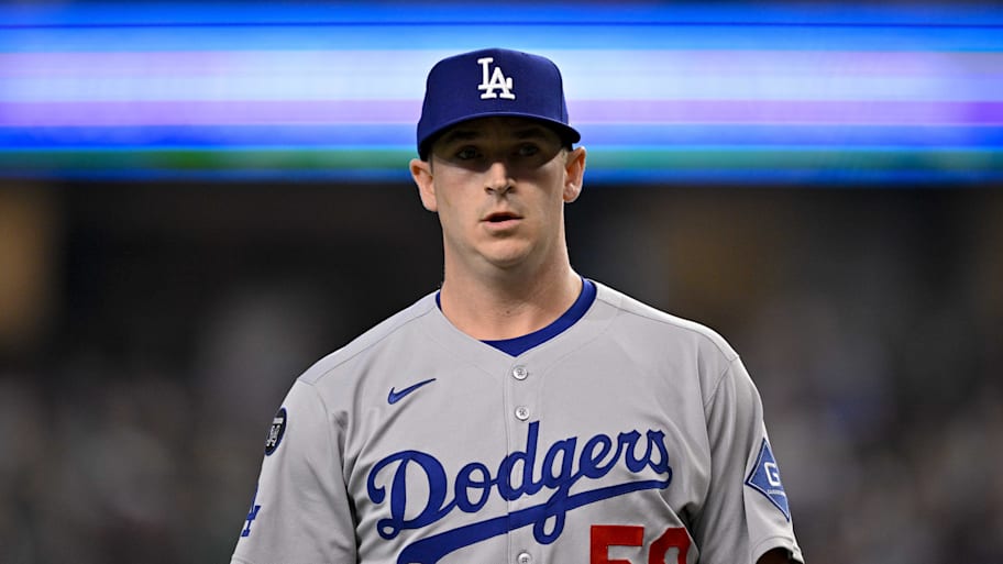 Evan Phillips walks off the field against the Rangers. | Jerome Miron-Imagn Images