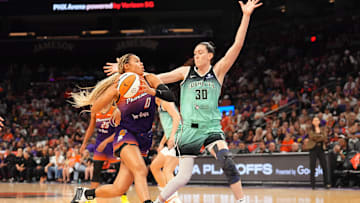 Sep 19, 2025; Phoenix, Arizona, USA; Phoenix Mercury forward Satou Sabally (0) drives against New York Liberty forward Breanna Stewart (30) during the second half of game three of round one for the 2025 WNBA Playoffs at PHX Arena. Mandatory Credit: Joe Camporeale-Imagn Images