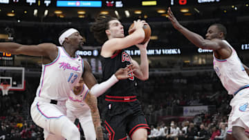 Apr 9, 2025; Chicago, Illinois, USA; Miami Heat center Bam Adebayo (13) defends Chicago Bulls guard Josh Giddey (3)