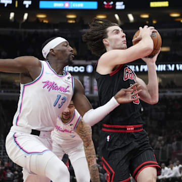 Miami Heat center Bam Adebayo (13) defends Chicago Bulls guard Josh Giddey (3) during the first quarter at United Center. Mandatory Credit: David Banks-Imagn Images