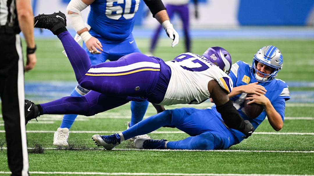 Nov 2, 2025; Detroit, Michigan, USA; Detroit Lions quarterback Jared Goff (16) is brought down by Minnesota Vikings defensive lineman Javon Hargrave (97) in the third quarter at Ford Field. Mandatory Credit: Lon Horwedel-Imagn Images