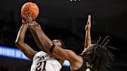 Texas A&M Aggies forward Pharrel Payne (21) shoots the ball as Vanderbilt Commodores forward Devin McGlockton (99) defends during the first half at Reed Arena. 