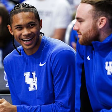 Oct 24, 2025; Lexington, KY, USA; Kentucky Wildcats guard Jaland Lowe (left) talks with guard Walker Horn (right) on the bench during the second half against the Purdue Boilermakers at Rupp Arena at Central Bank Center. Mandatory Credit: Jordan Prather-Imagn Images