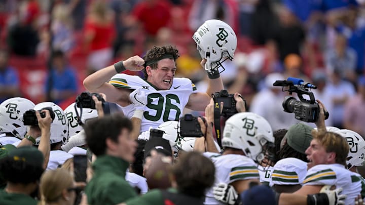Sep 6, 2025; Dallas, Texas, USA; Baylor Bears place kicker Connor Hawkins (96) celebrates with his teammates after he makes a game winning field goal to defeat the SMU Mustangs during the second overtime at Gerald J. Ford Stadium. Mandatory Credit: Jerome Miron-Imagn Images