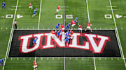 A general overall view as UNLV Rebels quarterback Jayden Maiava (1) throws the ball on the UNLV logo at midfield against the Boise State Broncos in the first half during the Mountain West Championship at Allegiant Stadium. Mandatory Credit: Kirby Lee-Imagn Images