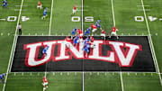 A general overall view as UNLV Rebels quarterback Jayden Maiava (1) throws the ball on the UNLV logo at midfield against the Boise State Broncos in the first half during the Mountain West Championship at Allegiant Stadium. Mandatory Credit: Kirby Lee-Imagn Images