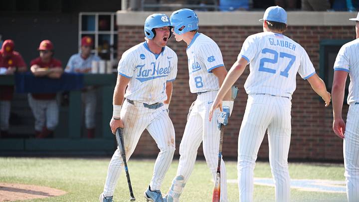June 7, 2026; Chapel Hill, NC, USA;  North Carolina Tar Heels infielder Cooper Nicholson (1) celebrates his run against the USC Trojans with North Carolina Tar Heels outfielder Owen Hull (8) during the ninth inning at Boshamer Stadium. Mandatory Credit: Zachary Taft-Imagn Images