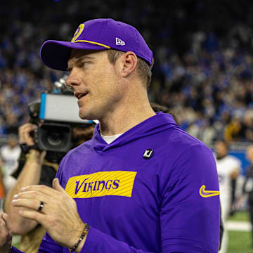 Jan 5, 2025; Detroit, Michigan, USA; Detroit Lions Head Coach Dan Campbell (L) shakes hands with Minnesota Vikings Head Coach Sean McDermott after the game at Ford Field.