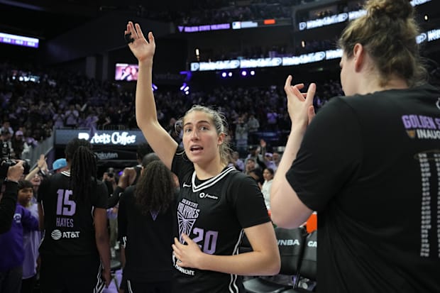 Golden State Valkyries guard Kate Martin waves to fans. 