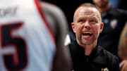 Mar 20, 2025; Lexington, KY, USA; Louisville Cardinals head coach Pat Kelsey talks to his team in a time out during the second half against the Creighton Bluejays in the first round of the NCAA Tournament at Rupp Arena. Mandatory Credit: Jordan Prather-Imagn Images