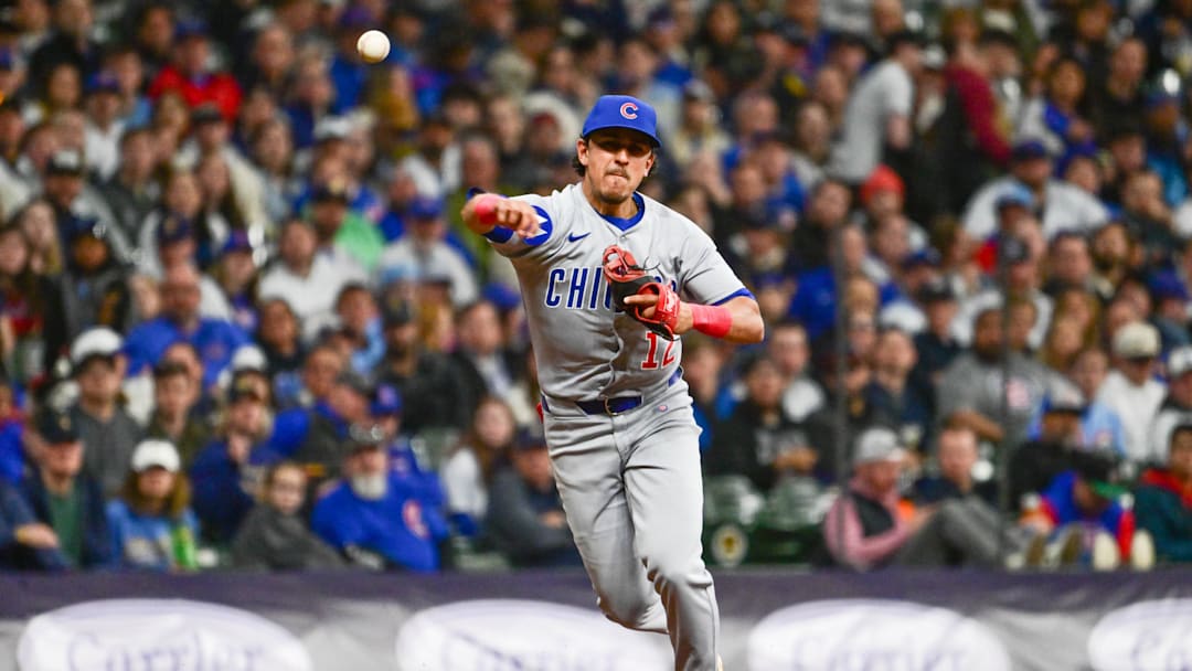 May 2, 2025; Milwaukee, Wisconsin, USA; Chicago Cubs third baseman Nicky Lopez (12) throws out Milwaukee Brewers center fielder Jackson Chourio (not pictured) in the third inning at American Family Field
