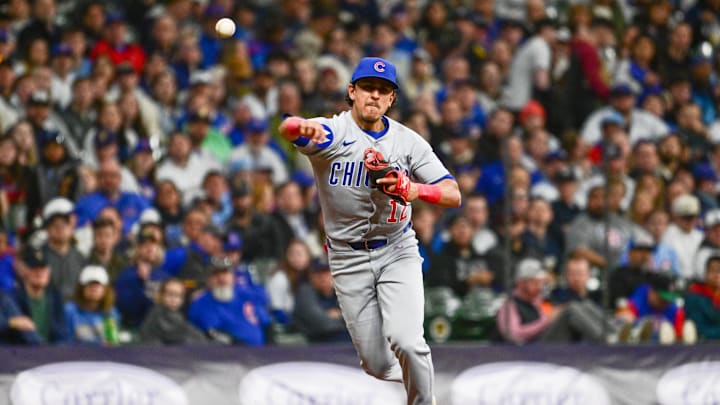 May 2, 2025; Milwaukee, Wisconsin, USA; Chicago Cubs third baseman Nicky Lopez (12) throws out Milwaukee Brewers center fielder Jackson Chourio (not pictured) in the third inning at American Family Field