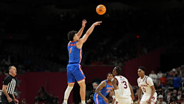 Apr 5, 2025; San Antonio, TX, USA; Florida Gators guard Walter Clayton Jr. (1) shoots the ball against the Auburn Tigers during the first half in the semifinals of the men's Final Four of the 2025 NCAA Tournament at the Alamodome. Mandatory Credit: Bob Donnan-Imagn Images