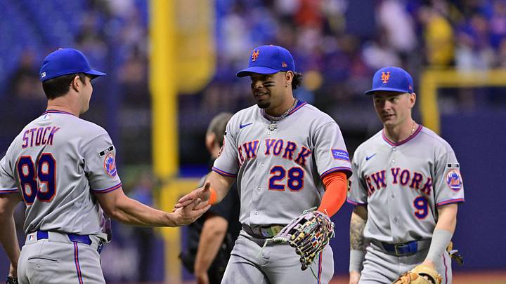 Aug 31, 2026; St. Petersburg, Florida, USA;  New York Mets pitcher Robert Stock (89) and left fielder Christopher Morel (28) celebrate the end of the fifth inning against Tampa Bay Rays at Tropicana Field.  Mandatory Credit: Pablo Robles-Imagn Images