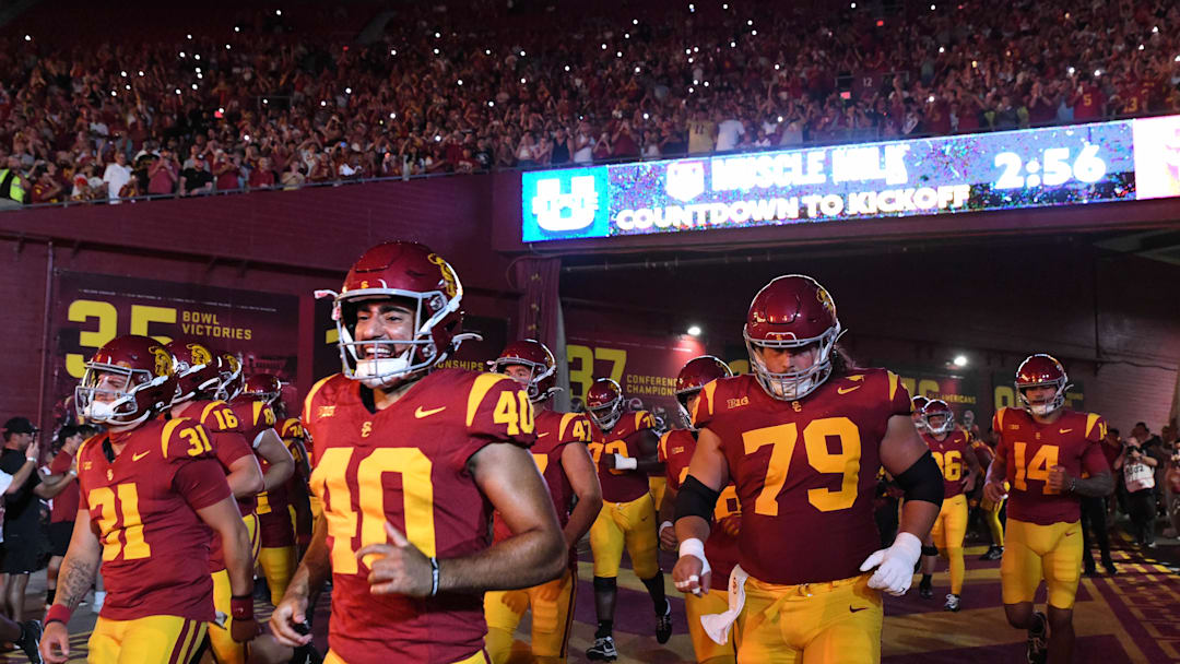 Sep 7, 2024; Los Angeles, California, USA; The USC Trojans run out of the tunnel before the game against the Utah State Aggies at United Airlines Field at Los Angeles Memorial Coliseum. Mandatory Credit: Jonathan Hui-Imagn Images