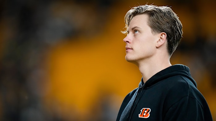 Injured Cincinnati Bengals quarterback Joe Burrow (9) heads to the locker room after the fourth