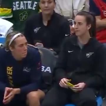 Caitlin Clark was seen having a little snack during the Fever's win over the Storm on Sunday. 