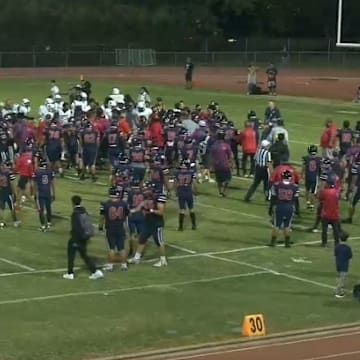 Bishop Montgomery (in the white) had numerous players leave the sidelines against Saint Louis High in Hawaii, which resulted in massive suspensions.