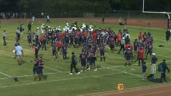 Bishop Montgomery (in the white) had numerous players leave the sidelines against Saint Louis High in Hawaii, which resulted in massive suspensions.