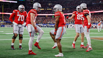 Will Howard #18 and Quinshon Judkins #1 of the Ohio State Buckeyes celebrate a touchdown against the Texas Longhorns during the Goodyear Cotton Bowl at AT&T Stadium on January 10, 2025 in Arlington, Texas.