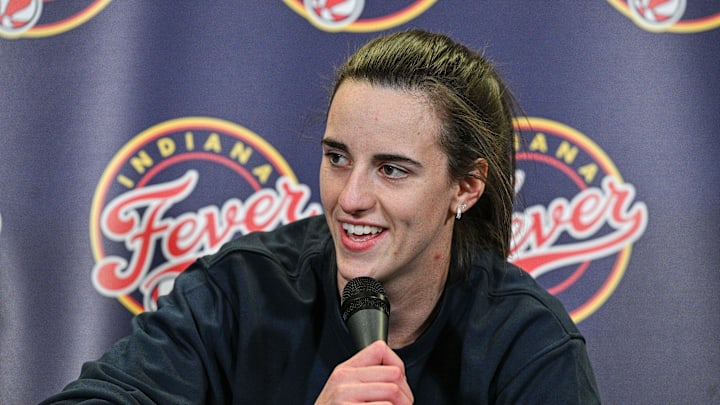  Indiana Fever guard Caitlin Clark (22) answers questions before the preseason game against the Brazil National Team at Carver-Hawkeye Arena.  