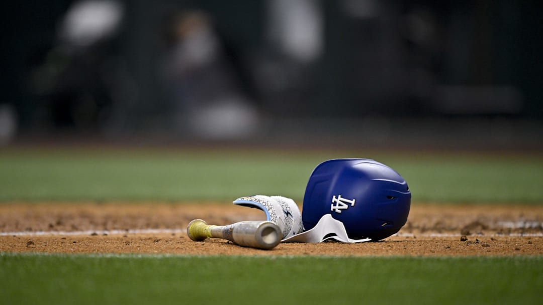A view of a Los Angeles Dodgers batting helmet and bat during the game between the Texas Rangers and the Los Angeles Dodgers at Globe Life Field on April 20.
