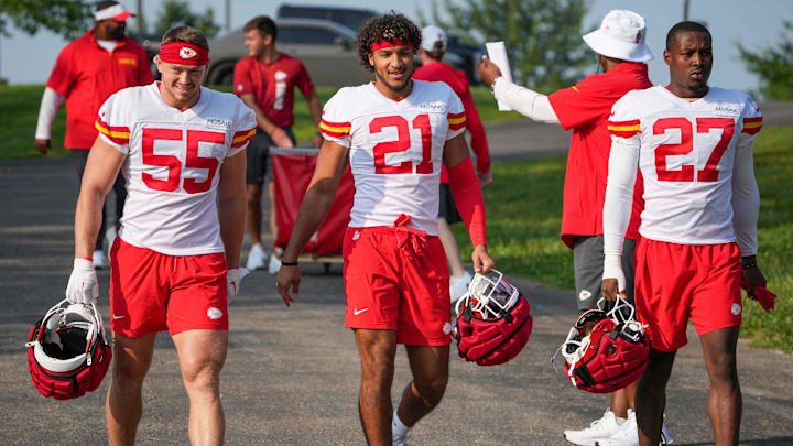 Jul 22, 2024; St. Joseph, MO, USA; Kansas City Chiefs linebacker Swayze Bozeman (55) and safety Jaden Hicks (21) and safety Chamarri Conner (27) walk down the hill from the locker room to the fields prior to training camp at Missouri Western State University. Mandatory Credit: Denny Medley-Imagn Images