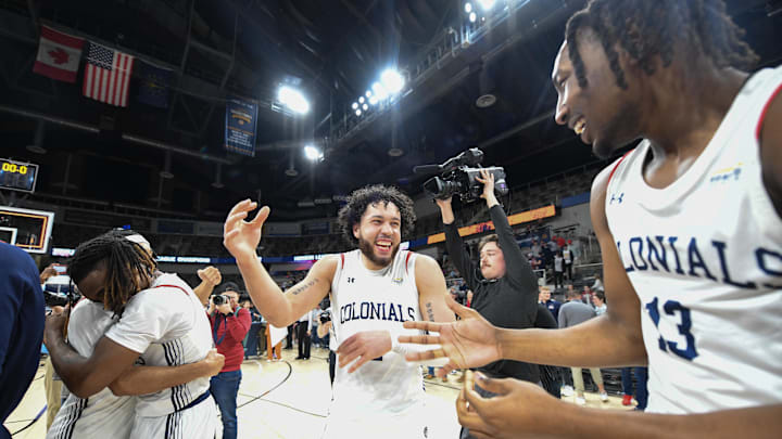 Mar 11, 2025; Indianapolis, IN, USA; Robert Morris Colonials guard Ryan Prather Jr. (2) and Robert Morris Colonials forward Antallah Sandlin-El (13) celebrate after defeating the Youngstown State Penguins to win the Horizon League Championship at Corteva Coliseum. Mandatory Credit: Robert Goddin-Imagn Images