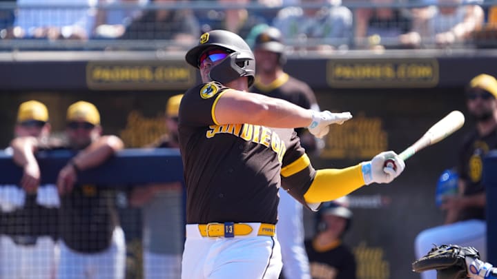 Ty France (4) bats against the Texas Rangers during the second inning at Peoria Sports Complex.