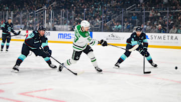 Mar 31, 2025; Seattle, Washington, USA; Dallas Stars center Wyatt Johnston (53) scores a goal against the Seattle Kraken during the first period at Climate Pledge Arena. Mandatory Credit: Steven Bisig-Imagn Images