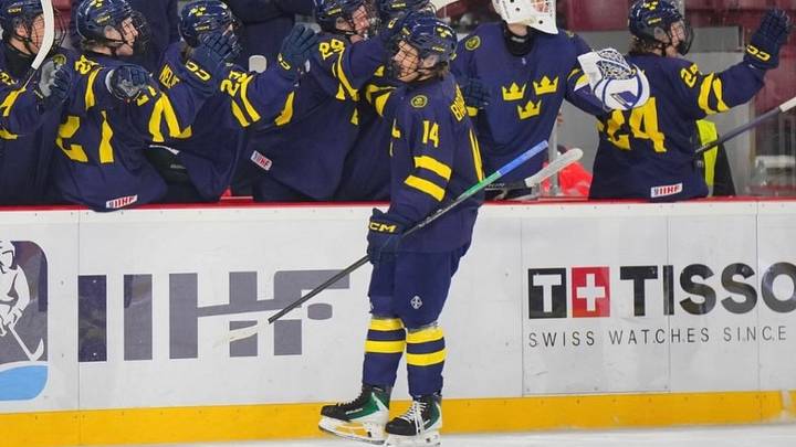 Nils Bartholdsson skates by the Sweden bench. The forward has represented his country in multiple youth tournaments. Nils Bartholdsson skates by the Sweden bench. The forward has represented his country in multiple youth tournaments.