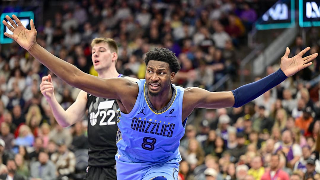 Dec 23, 2025; Salt Lake City, Utah, USA; Memphis Grizzlies forward/center Jaren Jackson Jr. (8) looks for a foul call during the first half against Utah Jazz center Kyle Filipowski (22) at Delta Center. Mandatory Credit: Peter Creveling-Imagn Images