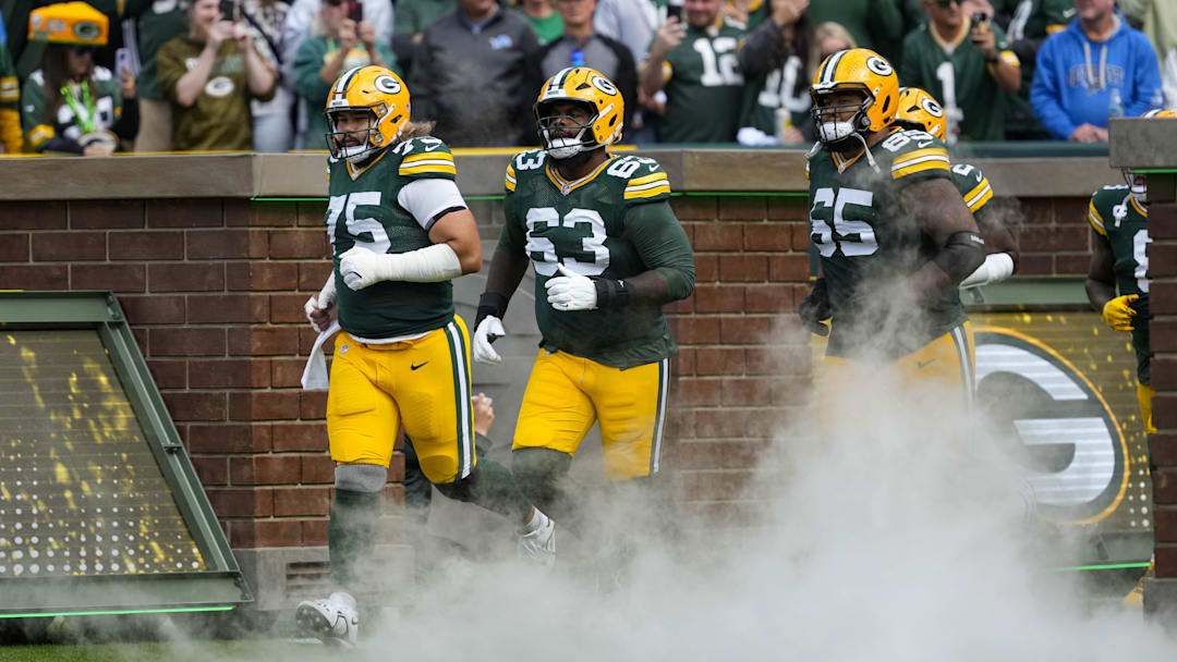 Sep 7, 2025; Green Bay, Wisconsin, USA;  Green Bay Packers guard Sean Rhyan (75), offensive tackle Rasheed Walker (63) and guard Aaron Banks (65) prior to the game against the Detroit Lions at Lambeau Field. Mandatory Credit: Jeff Hanisch-Imagn Images