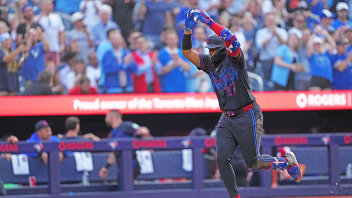 Jul 24, 2024; Toronto, Ontario, CAN; Toronto Blue Jays first baseman Vladimir Guerrero Jr. (27) runs the bases and celebrates hitting a home run against the Tampa Bay Rays during the third inning at Rogers Centre. 