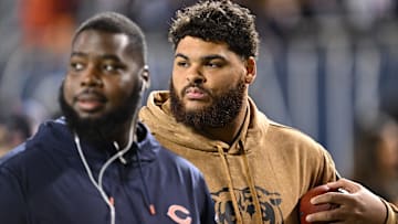 Nov 9, 2023; Chicago, Illinois, USA;  Chicago Bears offensive lineman Darnell Wright (58) warms up on the field before a game against the Carolina Panthers at Soldier Field. Mandatory Credit: Jamie Sabau-Imagn Images