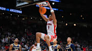Arizona Wildcats forward Carter Bryant (9) dunks the ball against the Akron Zips during the first half in the first round of the NCAA Tournament at Climate Pledge Arena.