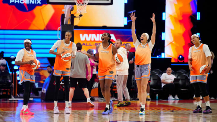 July 19: WNBA All-Star players DeWanna Bonner (second from left), Aliyah Boston, Dearica Hamby and Brionna Jones react after Chicago Sky forward Angel Reese makes a half-court shot during practice for Saturday's All-Star Game against the U.S. Olympic team.