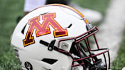 Oct 25, 2025; Iowa City, Iowa, USA; A Minnesota Golden Gophers football helmet is seen on the field before the game against the Iowa Hawkeyes at Kinnick Stadium. Mandatory Credit: Jeffrey Becker-Imagn Images