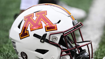 Oct 25, 2025; Iowa City, Iowa, USA; A Minnesota Golden Gophers football helmet is seen on the field before the game against the Iowa Hawkeyes at Kinnick Stadium. Mandatory Credit: Jeffrey Becker-Imagn Images