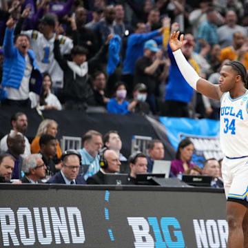 Mar 18, 2023; Sacramento, CA, USA; UCLA Bruins guard David Singleton (34) and guard Amari Bailey (5) react during the second half against the Northwestern Wildcats at Golden 1 Center. Mandatory Credit: Kyle Terada-Imagn Images