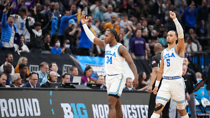 Mar 18, 2023; Sacramento, CA, USA; UCLA Bruins guard David Singleton (34) and guard Amari Bailey (5) react during the second half against the Northwestern Wildcats at Golden 1 Center. Mandatory Credit: Kyle Terada-Imagn Images