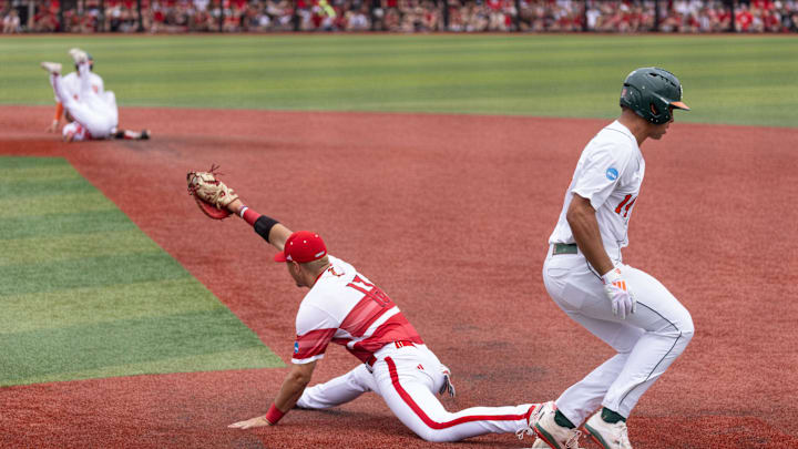 Louisville utility Tague Davis stretches to complete the double play during the NCAA baseball Super Regional game 2 at Jim Patterson Stadium on June 7, 2025 in Louisville, Ky.