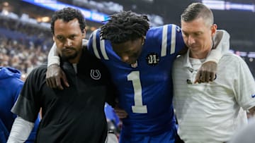 Indianapolis Colts cornerback Sauce Gardner (1) is helped off the field following an injury Sunday, Nov. 30, 2025, during a game against the Houston Texans at Lucas Oil Stadium in Indianapolis.