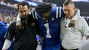 Indianapolis Colts cornerback Sauce Gardner (1) is helped off the field following an injury Sunday, Nov. 30, 2025, during a game against the Houston Texans at Lucas Oil Stadium in Indianapolis.