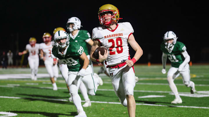 Mount Olive RB Adam DeCristofaro finds daylight on his way to a long TD run.